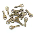 Detailed macro view of vintage bronze alloy key charms for DIY jewelry making - Bronze