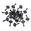 Macro detail of black heart-shaped key charms with beaded texture for DIY jewelry - Black