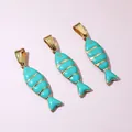 Detailed macro of gold striped fish pendants with bright turquoise blue oil drip finish - Cyan Style(E6-82)