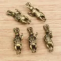 Five vintage 3D rabbit charms in bronze alloy for DIY jewelry and necklaces - Bronze