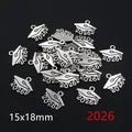 Detailed macro view of 2026 graduation cap pendants in antique silver alloy finish - 2026 Graduation Cap Style (R7-41)