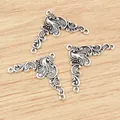 Three antique silver flower alloy connectors for DIY jewelry making on wood background - Antique Silver