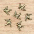 Vintage bronze swallow bird charms for DIY jewelry making with dual connector rings - Bronze