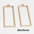 Paire de pendentifs cadres rectangulaires dorés 20x45mm pour création de bijoux DIY et résine - 20x45mm