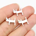 Three silver alloy cat pendants for DIY jewelry making shown on a fingertip - Antique Silver