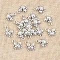 Bulk silver crab alloy charms for DIY jewelry making on natural burlap background - Antique Silver
