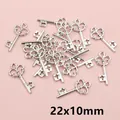 Retro silver alloy key charms for DIY jewelry making, size 22x10mm in bulk stack - Hollow Pattern Style (AF2-47)