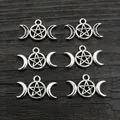Antique silver moon and pentagram alloy charms for DIY necklaces on wood background - Antique Silver