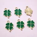 Détail de 6 pendentifs trèfle à quatre feuilles en émail vert et bordure dorée - Vert foncé