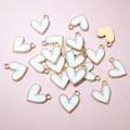 Detailed view of bulk heart pendants with white enamel finish and gold beaded edges - White (AJ5-07)