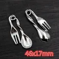 Macro detail of antique silver alloy spoon and fork charms measuring 46x17mm for DIY jewelry - Fork And Spoon Combo Style (AF2-22)