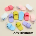 Macro detail of colorful resin shoe pendants with smiley face prints and metal rings - Smiley Face Pattern Slipper Style(H1-35)