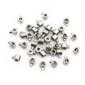 Detailed close-up of polished stainless steel cord lock end stoppers for DIY jewelry - 3x2.5mm / Steel