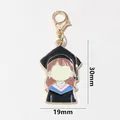 Detail view of cartoon graduation cap charm with dimensions 30mm x 19mm and lobster clasp - Graduate Girl Cartoon (SG-C6-52-AB1-02)