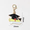 Enamel graduation cap and scroll pendant with lobster clasp for keychains, 23mm size - Cap Heart Scroll (SG-F6-24-AB1-02)
