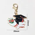 Graduation cap charm with red roses and books, 26x23mm gold-plated enamel pendant - Cap Bouquet Books (SG-Z4-29-AB1-02)