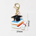 Golden graduation cap and colorful books enamel charm with lobster clasp 21mm - Cap Stacked Books (SG-Z6-18-AB1-02)