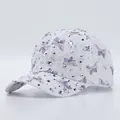 White lace baseball cap with purple butterfly print and silver rhinestones on a studio background - Adjustable / Purple