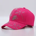Close-up of bright pink cotton baseball cap with rhinestone butterfly and dragonfly patterns - Floral Pattern / Rose Red