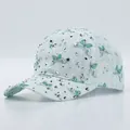 Mint green lace baseball cap featuring silver rhinestones and butterfly patterns - Adjustable / Green
