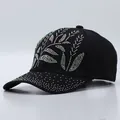 Detailed close-up of sparkling colorful rhinestones on a black cotton baseball cap - Bamboo Leaf Pattern / Black