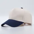Close-up of contrast stitch baseball cap with beige cotton fabric and navy blue brim - Adjustable / Beige With Navy Blue Brim