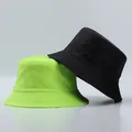 Detail of reinforced stitching on brim of black and neon green fisherman sun hats - One Size / Light Green And Black