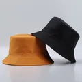 Detail of lightweight quick-dry bucket hats in orange and black with reinforced stitching - One Size / Orange And Black
