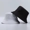 Detail of reinforced stitching on brim of minimalist black and white bucket hats - One Size / White and Black