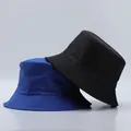 Detail view of cotton bucket hats in navy and black with reinforced stitched brims - One Size / Royal Blue And Black