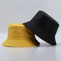 Close-up of yellow and black bucket hats with reinforced stitching details and fabric texture - One Size / Yellow and Black