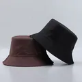 Detail showing high-quality stitching on dark brown and black bucket hats in studio lighting - One Size / Coffee And Black