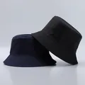Detailed stitching and fabric texture on dark blue and black nylon bucket hats - One Size / Navy Blue And Black