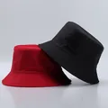 Close-up of matte nylon fisherman hats in red and black with layered stitching detail - One Size / Red and Black