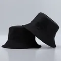 Detailed view of black bucket hat showing rows of stitching on the brim and fabric texture - One Size / Black And Black