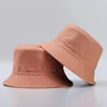 Detail view of salmon pink bucket hats featuring reinforced stitching on the brim - One Size / Pink And Pink