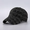 Close-up of black tweed baseball cap with white and gold metallic fiber textures - Black White Gold Tweed (6#)