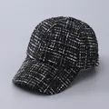 Close-up detail of the black and white houndstooth tweed texture on this baseball cap - Adjustable / Black Sequin Tweed Style
