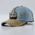 Light blue denim baseball cap with gold skull studs and rhinestone brim details - Adjustable / Light Blue Denim Middle Finger