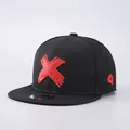 Classic black snapback baseball cap featuring a bold red embroidered X on the front - Adjustable / Hat Only / Red