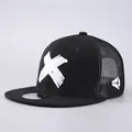 Black snapback hat with white X embroidery and breathable mesh back in side view - Adjustable / Trucker Hat / White