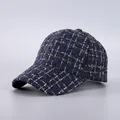 Detail of navy tweed baseball cap with gold metallic threads and textured weave pattern - Navy Gold Tweed (16#)