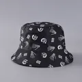 Detail of Halloween bucket hat featuring white skull and skeleton hand prints on black fabric - Black With Skeleton Hands (2# Color)