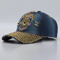 Navy denim baseball cap with skull embroidery and gold rhinestone-encrusted brim - Adjustable / Medium Blue Denim Colorful Skull