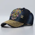 Navy blue denim baseball cap featuring skull embroidery and gold rhinestone brim decor - Adjustable / Dark Blue Denim Colorful Skull