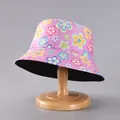 Detailed close-up of pink bucket hat with colorful flower patterns on a wooden stand - Pink Colorful Floral Print (26#)