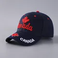 Detailed embroidery of Canada script and maple leaf on navy cotton baseball cap - Adjustable / Navy Blue Maple Leaf Letters