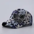 Lace floral baseball cap with rhinestone butterfly detail shown in a stylish side view - Adjustable / Navy Blue