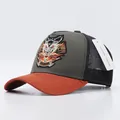 Three-color mesh trucker cap in olive, black, and orange with wolf embroidery - Lion Gray Orange Brim