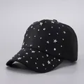 Detailed view of black baseball cap decorated with silver star and dot metallic rivets - Adjustable / Black Star Rhinestones